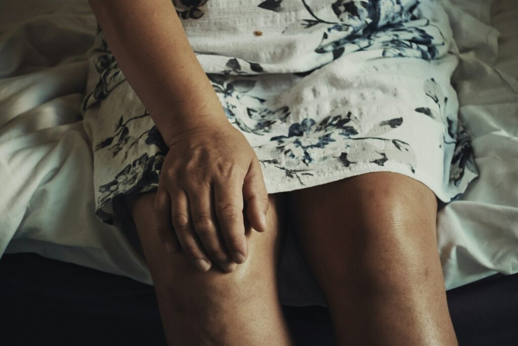 Woman resting her hand on her knee