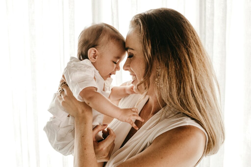 Smiling mother holding her baby